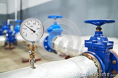 Manometer pipes and valve in water pump station Stock Photo