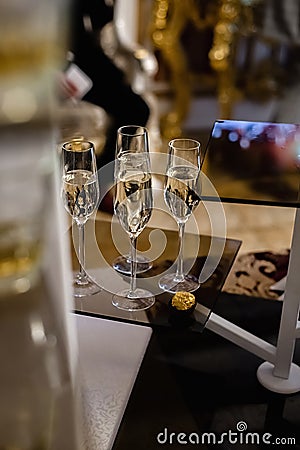 Closeup of many glasses of fresh champagne on bar table. Stock Photo