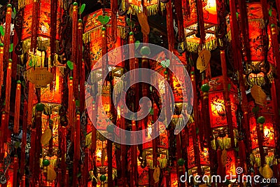 Closeup of many lit red lamps/lanterns in a temple Stock Photo