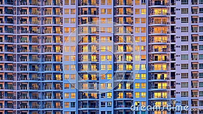 Closeup of many windows on a tall building Stock Photo