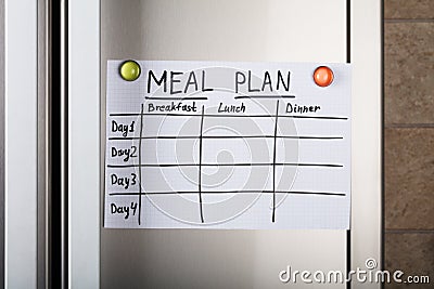 Daily Meal Plan Paper Attached With Magnetic Thumbtacks Stock Photo