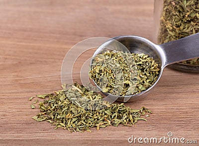 Closeup of a Measuring Spoonful of Chopped Parsley Stock Photo