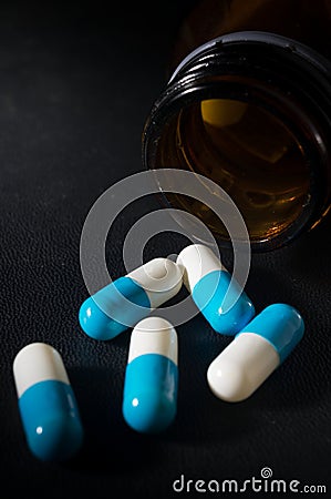 Closeup medicine capsules and bottle. Stock Photo