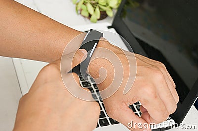 Closeup men touch on watch hand Stock Photo