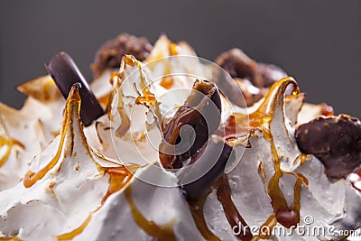Closeup meringue cake with chocolate, caramel, and filled chocol Stock Photo