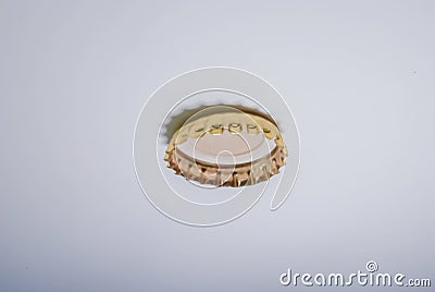 Closeup of a metal bottlecap on white surface Stock Photo