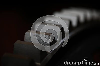 Closeup of metal cogwheel on dark background as part of full machine Stock Photo