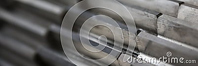Closeup of metal cogwheel on dark background as part of full machine Stock Photo