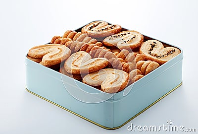 Closeup metal gift box full of biscuits, on white background Stock Photo