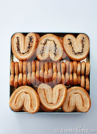 Closeup metal gift box full of biscuits, on white background Stock Photo