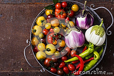 Closeup of metallic basket with fresh vegetables Stock Photo