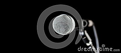 Closeup microphone. Vocal audio mic on a bleck background. Audio equipment. Karaoke concert, sing sound. Microphone, mic Stock Photo