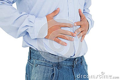 Closeup mid section of a casual man with stomach pain Stock Photo