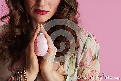 Closeup on middle aged woman with easter egg praying Stock Photo