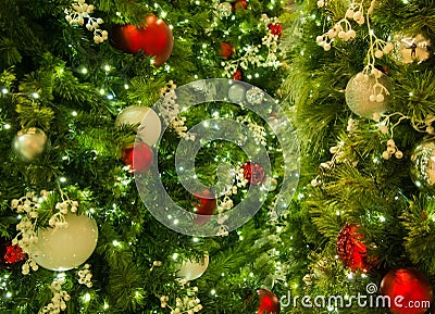 Closeup Of Mixed Christmas Ornaments On Tree With Lights In Frame Stock Photo
