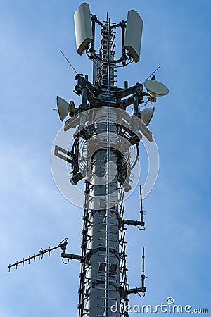 Closeup of mobile telecommunication tower or cell tower with antennae and electronic communications equipment Stock Photo