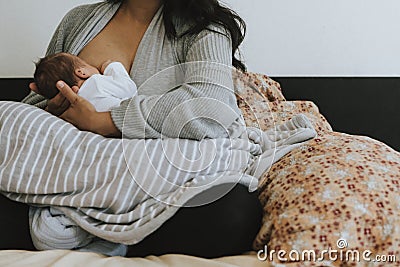 Closeup Mother breastfeeding her baby Stock Photo