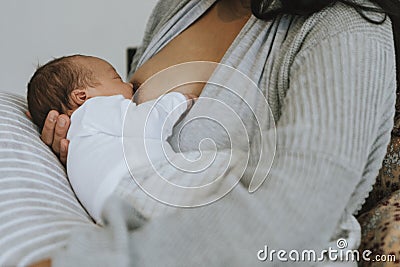 Closeup mother breastfeeding her baby Stock Photo