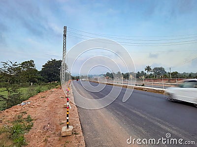 Motion blurred vehicle moving in the national highway roads of india Stock Photo