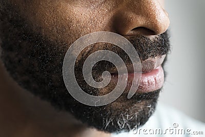 Closeup of a mouth of a black man Stock Photo