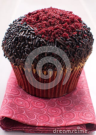 Closeup muffin with sprinkles and red sugar Stock Photo