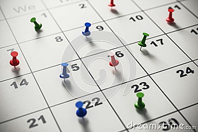 Closeup of multicolored pins on calendar dates, time management concept. Stock Photo