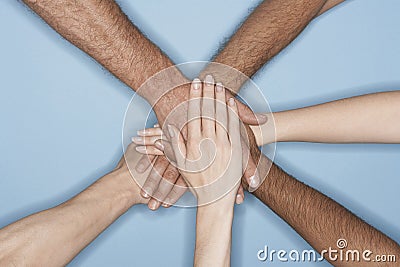 Closeup Of Multiethnic Hands On Top Of Each Other Stock Photo