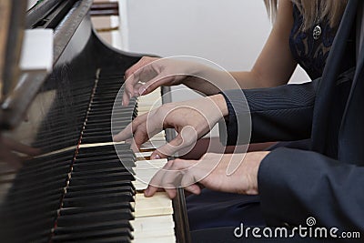 Closeup musician hands playing piano on piano keyboard Stock Photo