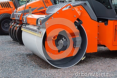 Closeup of new asphalt rollers in a row. Stock Photo