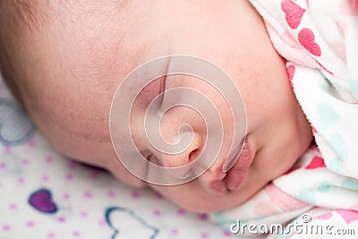 Closeup of a newborn baby sleeping in the crib, Stock Photo