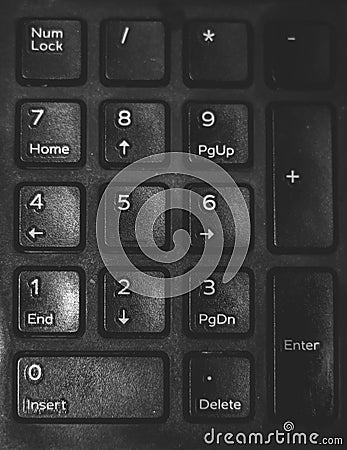 Closeup number keyboard of desktop for backgrounds or textures. keyboard with focus on the enter button in black and white Stock Photo