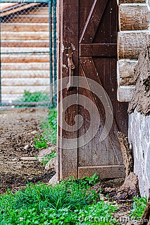 Closeup of an old rustic door of a farm house Stock Photo
