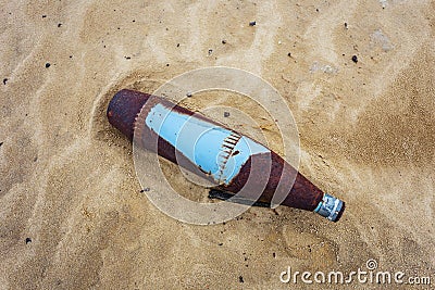 Old rusty bomb lie on sand, military firing background Stock Photo