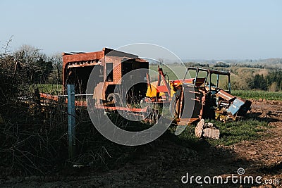 Closeup of old and rusty farming and agricultural equipment in a field in Somerset, UK Editorial Stock Photo