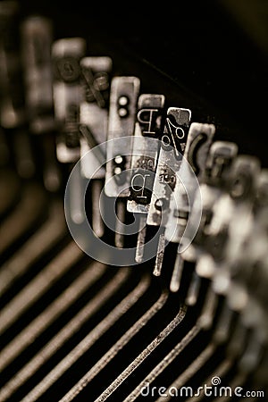 Closeup of old typewriter plates strikers strykers with letters and symbols for typing Stock Photo