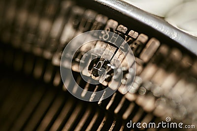 Closeup of old typewriter plates strikers strykers with letters and symbols for typing Stock Photo