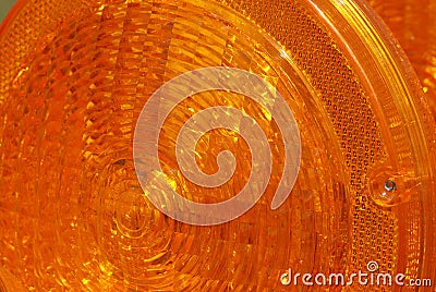 A closeup of the orange light on a folding barricade. Stock Photo