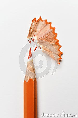 Orange pencil crayon and shavings Stock Photo