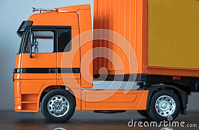 Closeup an orange trailer truck souvenir. Stock Photo