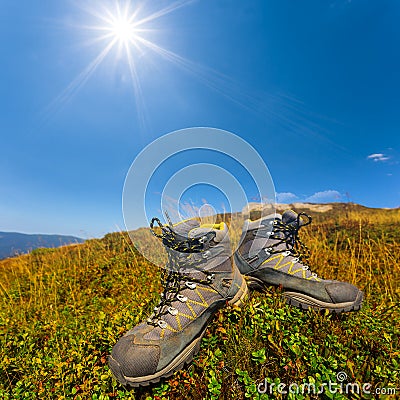 Closeup pair of touristic boot on a hill top Stock Photo