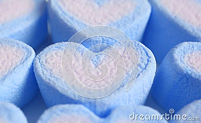 Closeup Pastel Blue and White Heart Shaped Marshmallow Candies in Rows Stock Photo