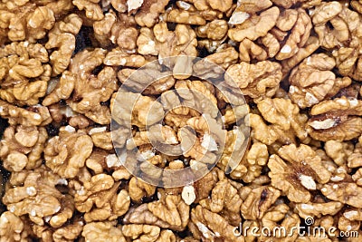 Closeup of Peeled Walnuts Pile. Walnuts Background. Many Different Textured Walnuts. Stock Photo