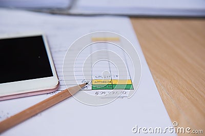 Closeup pencil with finance business sheet and phone . Business concept. Stock Photo