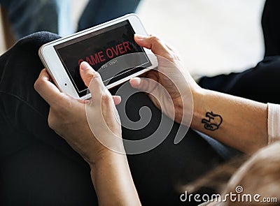 Closeup of people playing online game on mobile phone Stock Photo