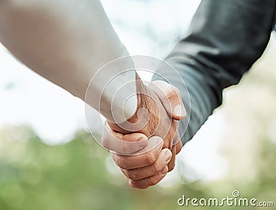 Closeup, people and shaking hands outdoor for meeting, introduction or hello in support, success or team. Handshake Stock Photo
