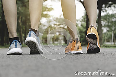 Closeup people walking with sport shoes on road in park for health concept Stock Photo