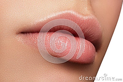 Closeup perfect natural lip makeup. Beautiful plump full lips on female face. Clean skin, fresh make-up. Spa tender lips Stock Photo