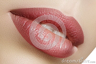 Closeup perfect natural lip makeup. Beautiful plump full lips on female face. Clean skin, fresh make-up. Spa tender lips Stock Photo