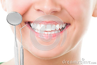 Closeup of perfect smile and dentist tools Stock Photo