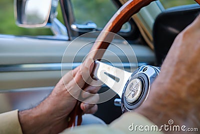 Closeup of person's hand driving a 1967 Mustang Shelby gt350 Editorial Stock Photo